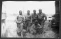 Photograph: [Soldiers between two military vehicles]