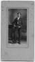 Photograph: [Photograph of a man holding a gun in his hand]