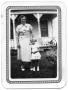 Primary view of [Mother and Young Daughter Standing on a Lawn Outside of a House]