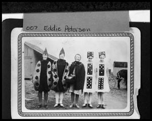Primary view of object titled '[Group of Girls Wearing Costumes and Masks]'.