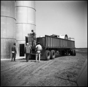 Primary view of object titled '[Men Unloading a Dump Truck]'.
