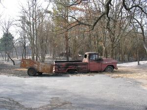 Primary view of object titled '[Burned pickup & trailer]'.