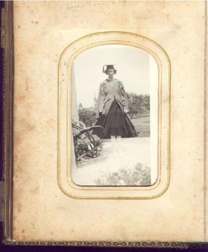 Primary view of object titled '[Hettie Lou in a cap and gown]'.