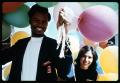 Thumbnail image of item number 1 in: '[Man and Woman Holding Balloons]'.