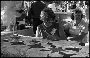 Primary view of object titled '[Woman Working on Quilt]'.