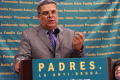 Primary view of [Carlos Ugarte speaking at a podium]