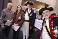 Primary view of [Two new citizens pose with two members of the Texas Society, sons of the American Revolution]