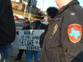 Thumbnail image of item number 1 in: '[Police officer and group of protesters]'.