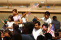 Photograph: [Protesters wave American flags]