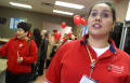 Photograph: [Women in a hallway with red balloons]