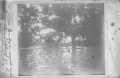 Primary view of [Four men sitting on "Old Bayou Bridge"]