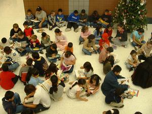 Primary view of object titled '[Students read books at Seminary Hills Elementary]'.