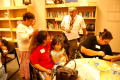 Primary view of [Carlos Francisco de Anda speaks to a parent during an Early Education Program class]
