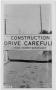 Thumbnail image of item number 1 in: '[Photograph of a Drive Carefully Sign]'.
