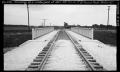 Photograph: [Photograph of Train Tracks Over an Underpass ]
