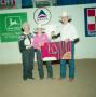 Primary view of [Matt Gully and two adults in Youth division award presentation at Will Rogers Coliseum #2]