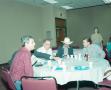 Photograph: [Men at table at breakfast gathering]