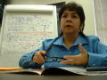 Photograph: [Elizabeth Lopez with paper chart in background]