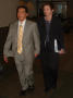 Primary view of [Couple in Business Suits Holding Hands, April 6, 2005]