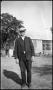 Primary view of [Photograph of a Man Standing Outside]