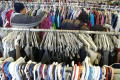 Primary view of [People search for the clothing they need at Dallas Catholic Charities]
