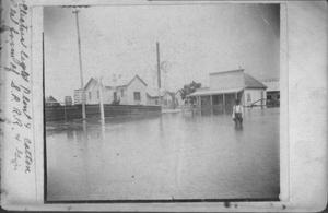 Primary view of object titled '[African American boy knee-deep in water during 1899 flood]'.