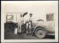 Photograph: [Jim Goin and Fred Cummings Delivering Ice]