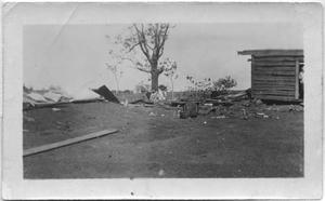 Primary view of object titled '[Storm Debris Next to Log House]'.