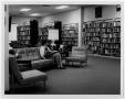 Primary view of [Visitor Reading at Helen Hall Library]