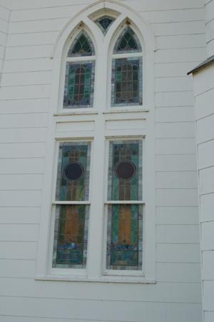 Primary view of object titled 'St. John the Baptist Catholic Church, detail of arched window'.
