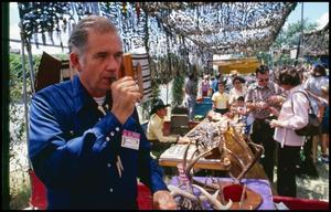 Primary view of object titled '[Johnny Stewart at Texas Wildlife Booth]'.