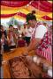 Photograph: [Man Stuffing German Sausage]