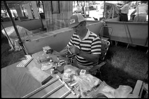 Primary view of object titled '[Charlie McTee Making Fishing Equipment]'.