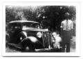 Photograph: Man standing in front of car