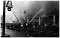 Primary view of [The Damron Hotel Fire, 12 of 21:   Numerous Fire Hoses Lying in Front of the Hotel]