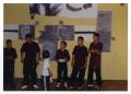 Photograph: [Break Dancers Gathered in Front of Artwork]