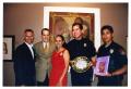 Photograph: [Sylvia Orozco, Jorge Sedeño, and Police Officers at Taste of Mexico]
