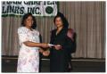 Photograph: [Woman Receiving Award During Salute to Youth Program]