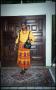 Primary view of [Woman in Yellow in Front of Doors]