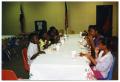 Photograph: [Children Eating During Christmas Party]