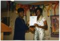 Primary view of [D'Shandra Walker Receiving Award at Service to Youth Award Program]