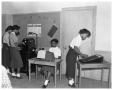 Photograph: [Students Operating Office Machines]