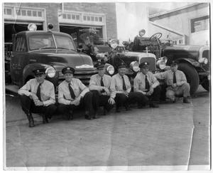 Primary view of object titled '[Fire Chief John Ballew with Firemen 1948]'.