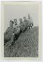Photograph: [Five Servicemen Sitting on a Hill]