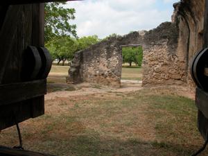 Primary view of object titled 'View of ruins at Mission Concepcion through a shuttered window'.