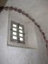 Photograph: Detail of window and decorative painting at Mission Concepción