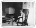 Photograph: Ray Delphenis watching television