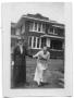 Photograph: Sammie Vise and Neely Vise holding hands near a house