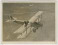 Photograph: [Ormer Locklear Balancing on Wing of Biplane]