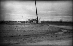 Primary view of object titled '[Vehicles and a Damaged Building After a Tornado]'.